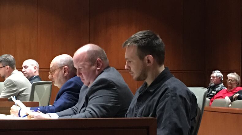 Zackary Lee Wilson listens Tuesday as prosecutors question witnesses in his murder trial in Warren County Common Pleas Court. STAFF/LAWRENCE BUDD