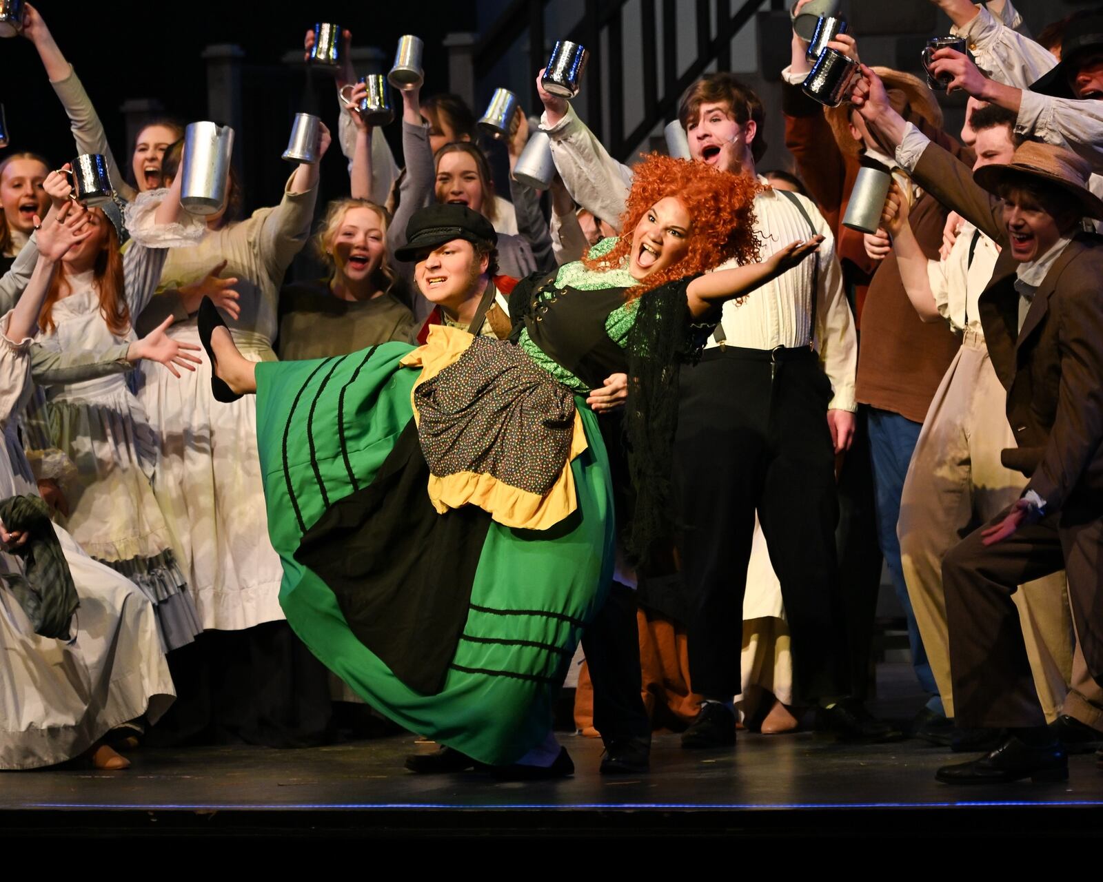 Lynn Dauterman (Madame Thenardier) and cast sing "Master of the House" in Kettering Fairmont High School's production of "Les Misérables: School Edition." Facebook photo