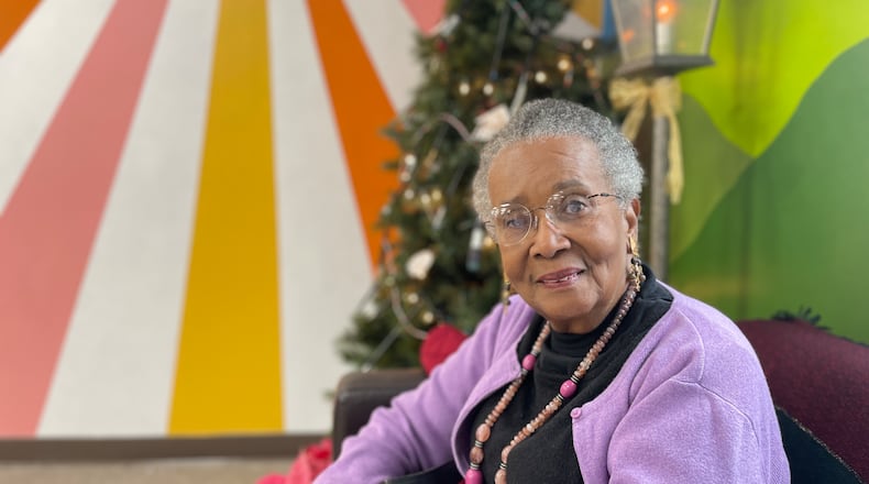 Lana Taylor, an artist-client at the nonprofit We Care Arts in Kettering, pictured at the nonprofit's Christmas party on Dec. 19, 2025. She has been taking classes at the nonprofit for about two years, which has helped her stay disciplined, helped with her healing and further cultivate her passion for art. SAM WILDOW/STAFF