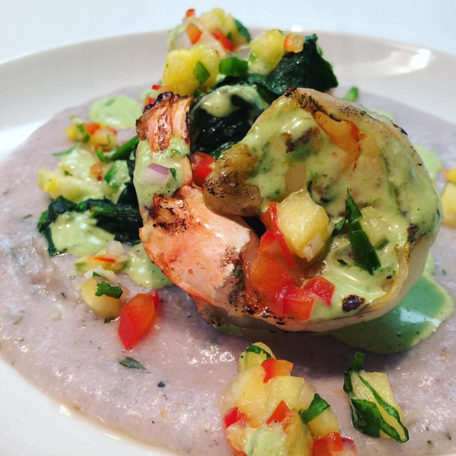 "Hot Juicy Tail" is just one of the Valentine's Day dishes featured at Corner Kitchen from Feb. 14-18, 2017. The dish features grilled shrimp, blue polenta, grilled pineapple, pico de gallo, and spicy cilantro aioli. CONTRIBUTED