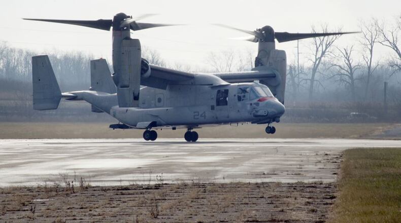A U.S. Marine Corps MV-22 Osprey belonging to Air Test and Evaluation Squadron 21 (HX-21) lands at Wright-Patterson Air Force Base, Area B, near the National Museum of the U.S. Air Force Dec. 19. The aircraft was signed over to Naval Medical Research Unit-Dayton to be used in research to minimize injuries to aircrew members. (U.S. Air Force photos/Richard Oriez)