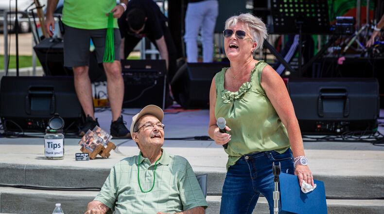 Ron Holp, founder of downtown Miamisburg business Ron’s Pizza and one of the creators of the Rock ‘N’ Green Tomato Festival, was honored at the festival Saturday at the city’s new Riverfront Park. Miamisburg Mayor Michelle Collins (right) presented Holp with a proclamation. CONTRIBUTED