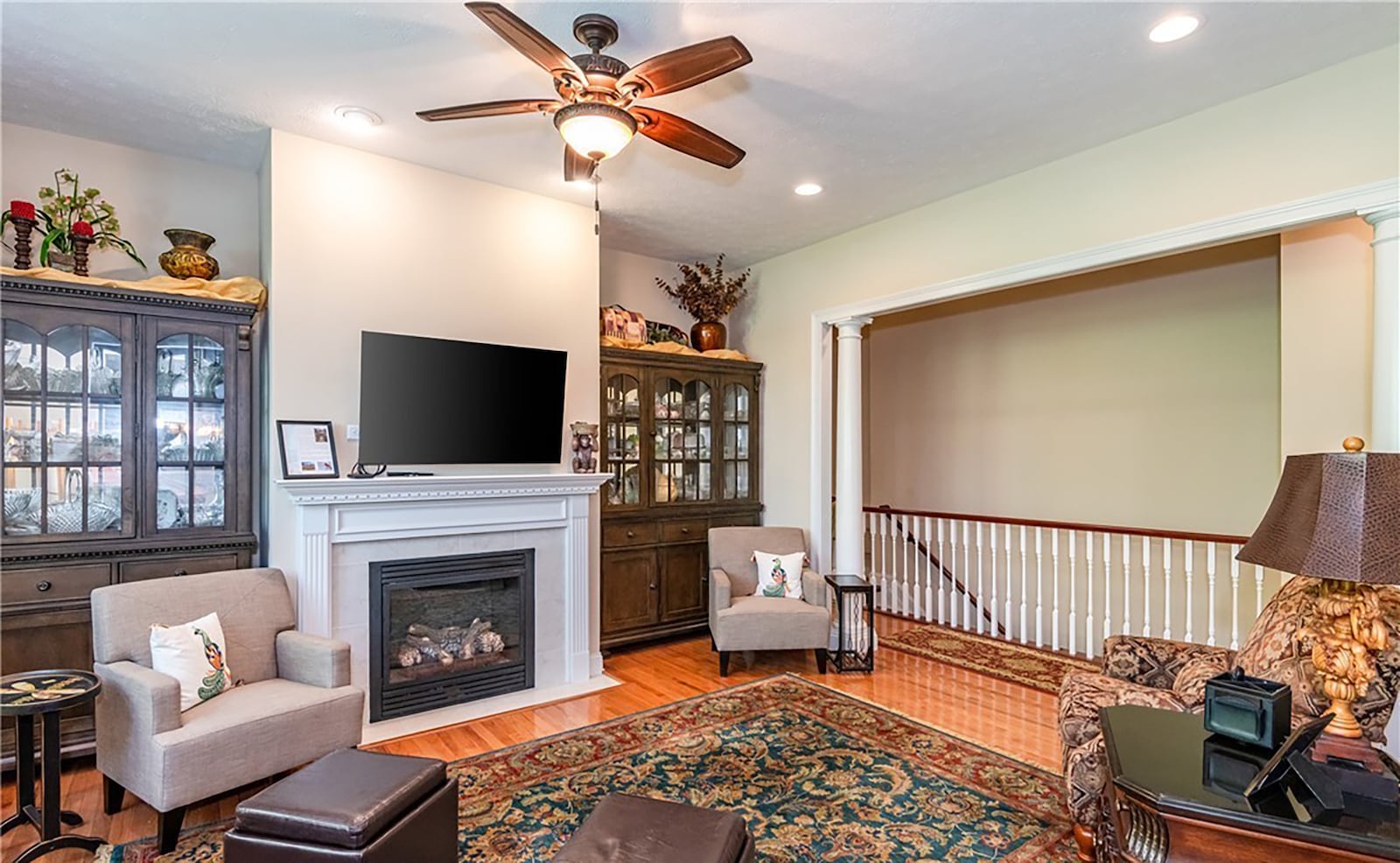 Off the kitchen is the family room. It has a gas fireplace, hardwood floors, a ceiling fan and recessed lighting. CONTRIBUTED