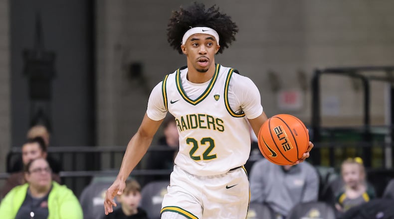 Wright State sophomore guard TJ Burch dribbles during a Horizon League game against Detroit Mercy on Thursday, Feb. 12 at Ervin J. Nutter Center in Fairborn. BRYANT BILLING / STAFF