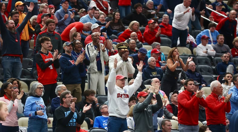 Dayton fans cheer during a game against St. Bonaventure in the quarterfinals of the Atlantic 10 Conference tournament on Friday, March 13, 2026, at PPG Paints Arena in Pittsburgh. David Jablonski/Staff