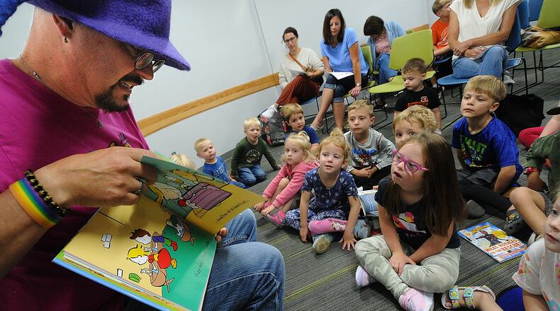 Tim Capehart, Beavercreek Library Head of Youth Services, reads a story during Preschool Storytime at the library, June 14, 2023. MARSHALL GORBY\STAFF