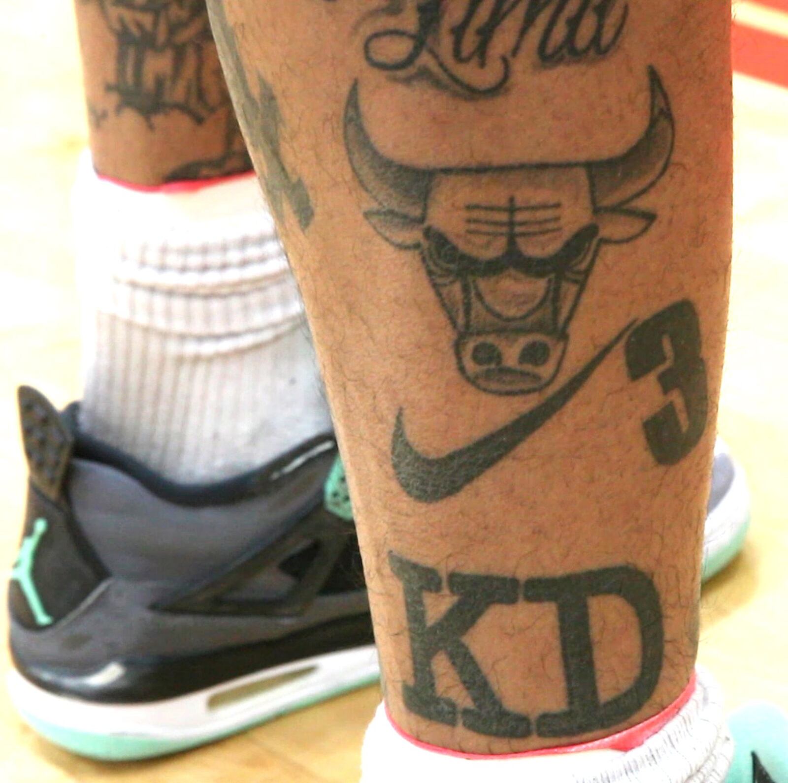 UD Flyers shooting guard Kyle Davis tells his life story through the tattoos he wears. Davis has the Chicago Bull for his hometown, his jersey number 3, and his initials “K.D.” TY GREENLEES / STAFF