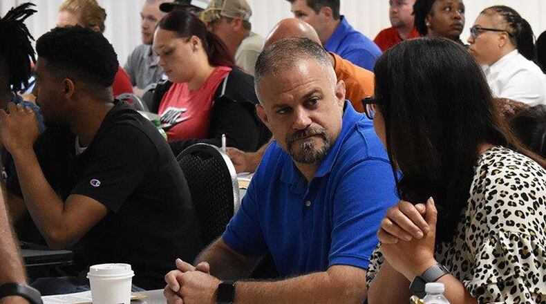 New civilian employees attend orientation during the first days of service at Robins Air Force Base, Ga. A new, standardized Air Force Materiel Command Civilian Acculturation program standardizes and streamlines the on-boarding process across the command. A key aspect of the model centers on a 4-day on-boarding expectation for new employees, including completion of new employee orientation, total force awareness training, common access card acquisition and unit in-processing requirements. (Air Force courtesy photo)