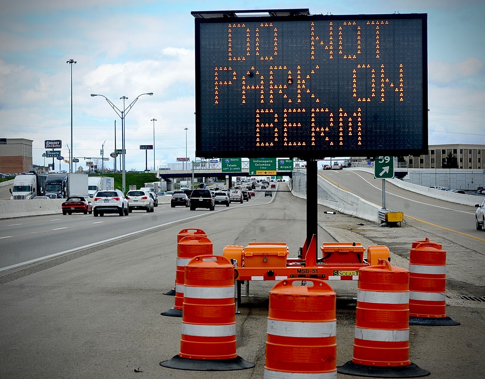 Do not park on berm signs can be seen along Interstate 75 going north from Montgomery County into Miami County due to the solar eclipse Monday, April 8, 2024. MARSHALL GORBY\STAFF