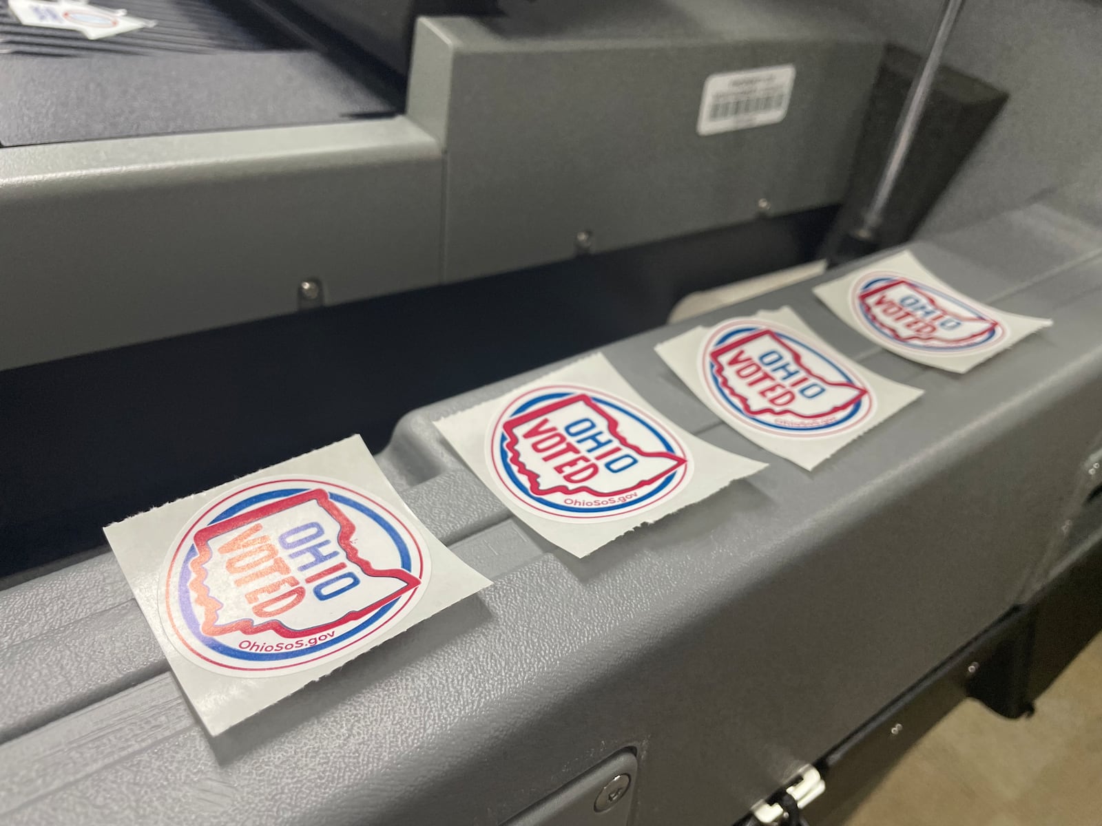 Stickers line a machine in the Montgomery County Board of Elections office. Early, in-person voting ends on Sunday.