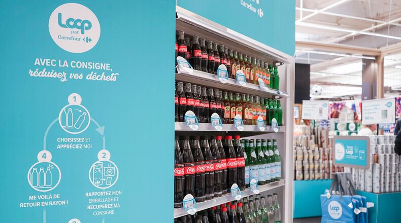 This photos provided by North America Public Relations shows Loop reusable packaging at French supermarket.  Reusable packaging is about to become more common at groceries and restaurants worldwide. Loop, which collects and sanitizes reusable containers, said Wednesday, Sept. 22, 2021 it’s expanding after successful trials in France and Japan.  Kroger and Walgreens in the U.S., and Tesco in the United Kingdom are among the groceries partnering with Loop. McDonald’s, Burger King and Tim Hortons have also signed on. (North America Public Relations via AP)
