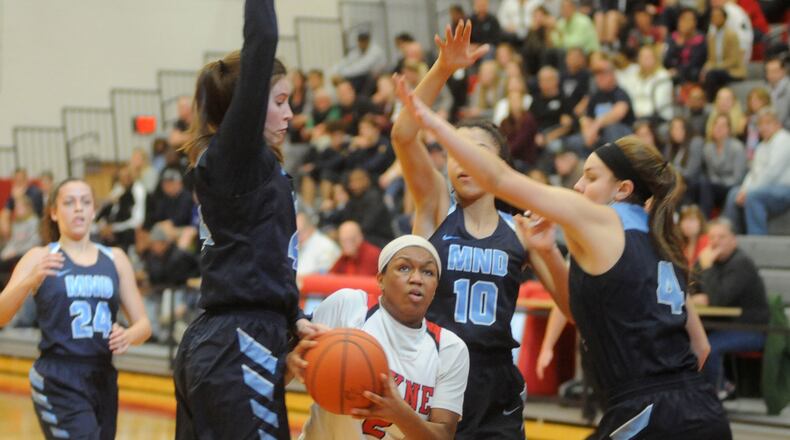 Nyla Hampton of Wayne (with ball) takes on three defenders. Mount Notre Dame defeated Wayne 48-28 in a girls high school basketball D-I district final at Princeton on Sat., March 3, 2018. MARC PENDLETON / STAFF