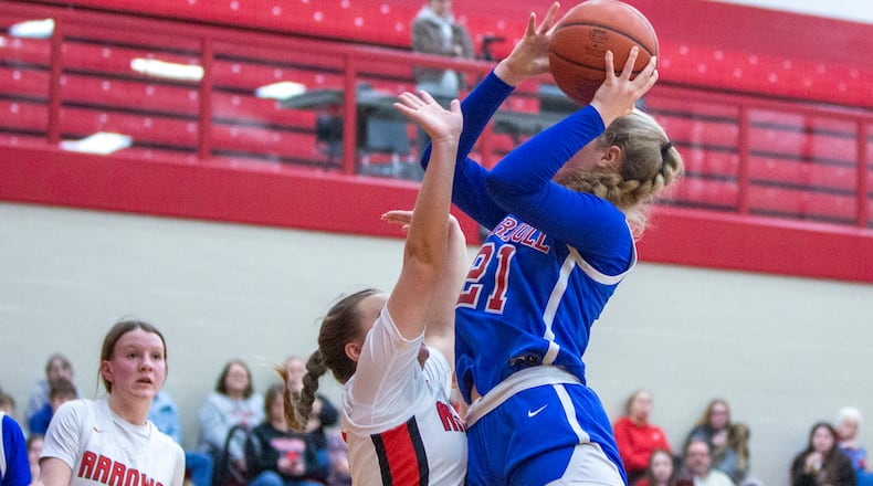 Carroll's Kiera Healy shoots over Tecumseh's Emma Garber during a second round Division II sectional tournament game in 2023. Jeff Gilbert/CONTRIBUTED