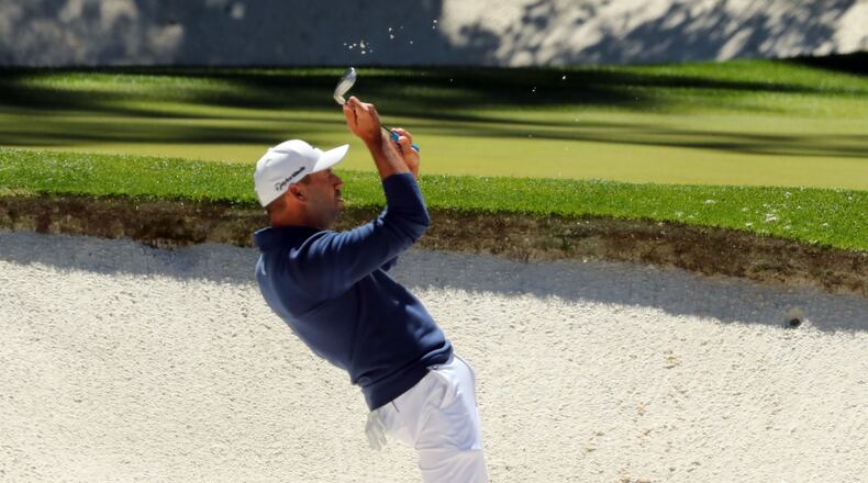 Sergio Garcia reacts to nearly chipping in for a birdie from the bunker on the 12th hole, which he later described as the best bunker shot of his life. (Curtis Compton/ccompton@ajc.com)