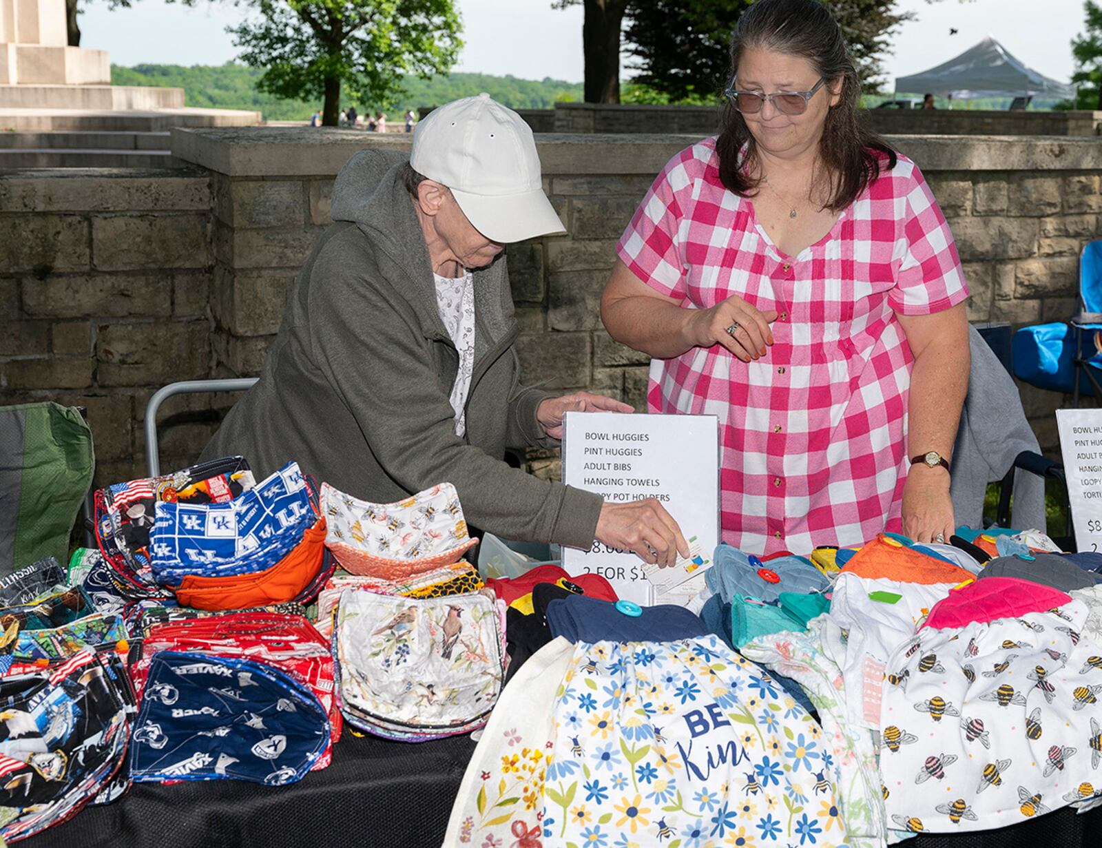 Robyn O’Bian (right) and Barbara Bordewisch-Beam, of Byrd’s Nest Creations set up their booth at the annual Wright-Patterson Air Force Base Pollinator Expo on June 8 at the Wright Brothers monument. U.S. AIR FORCE PHOTO/R.J. ORIEZ