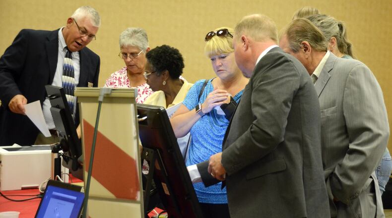 A couple hundred people came to the Butler County Board of Elections office last summer to test six voting machines from five vendors. The elections office will replace its machines with financial help from the state. MICHAEL D. PITMAN/2017