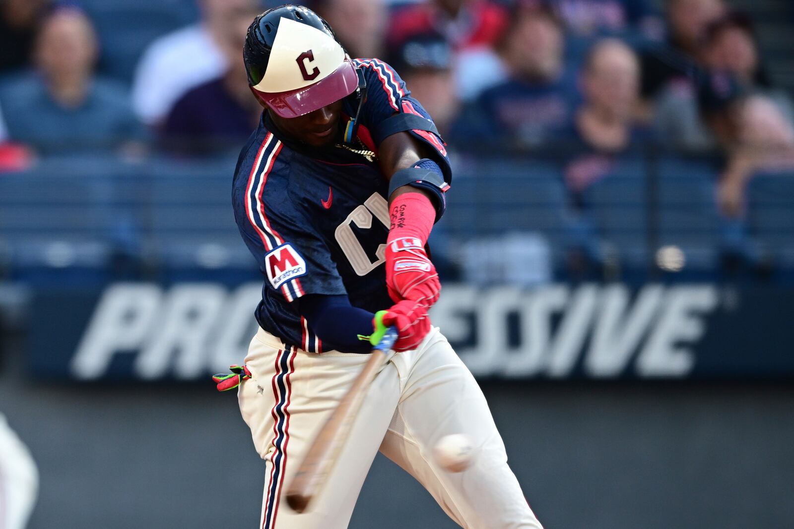 Cleveland Guardians' Johnathan Rodríguez hits an RBI single during the third inning of a baseball game against the Athletics, Friday, July 18, 2025, in Cleveland. Brayan Rocchio scored on the play. (AP Photo/David Dermer)
