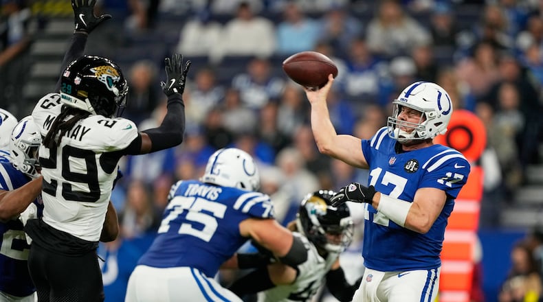Indianapolis Colts quarterback Philip Rivers (17) throws under pressure from Jacksonville Jaguars safety Eric Murray (29) during the second half of an NFL football game Sunday, Dec. 28, 2025, in Indianapolis. (AP Photo/Carolyn Kaster)
