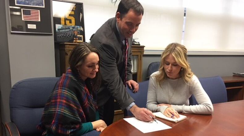 Luke Schultz, Small Business Office director, speaks with small business professionals, Jennifer Gallagher (left) and Kelly Thirtyacre, about cost-saving solutions small businesses can provide. (U.S. Air Force photo/Kimberly Gaither)