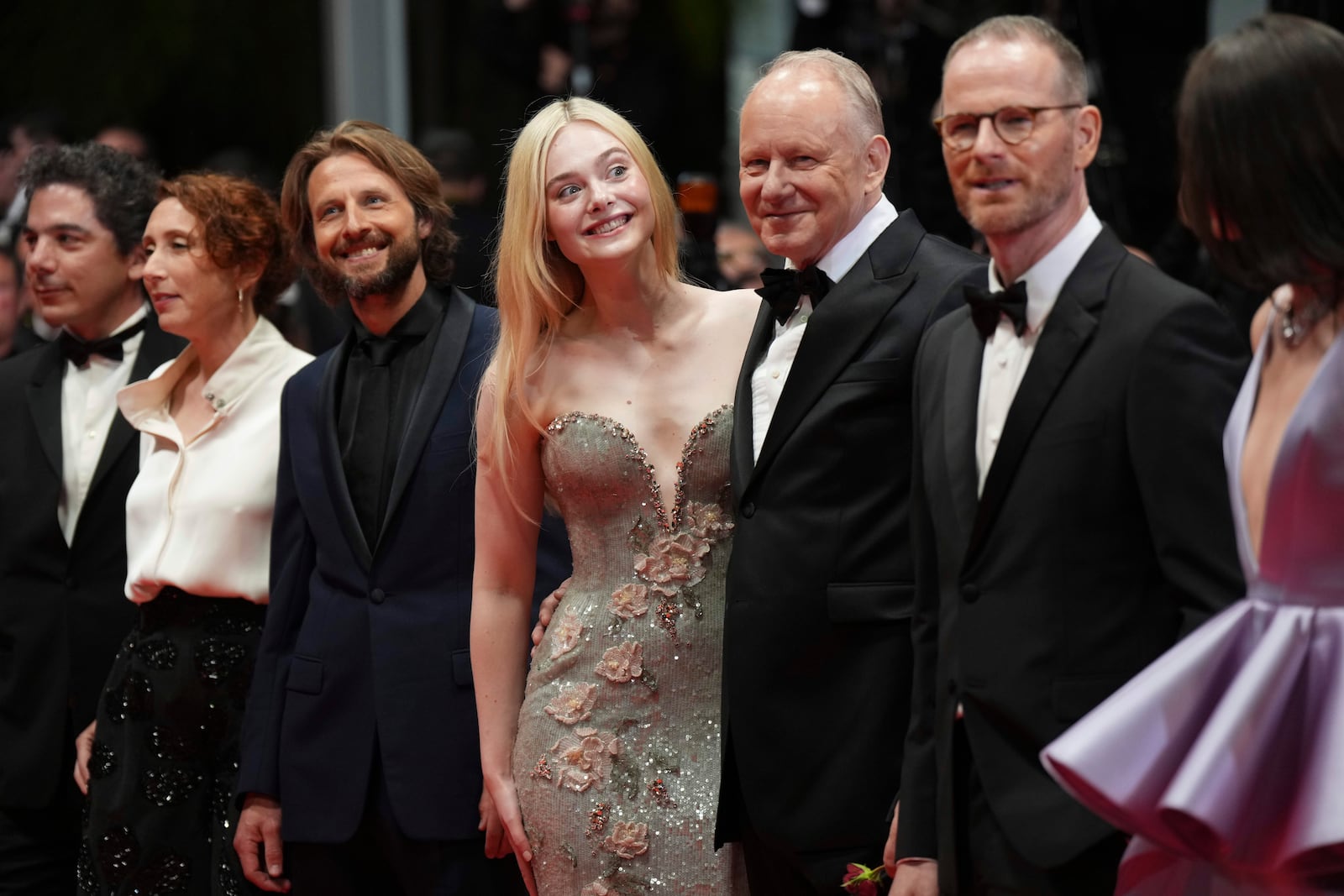 Anders Danielsen Lie, third from left, Elle Fanning, Stellan Skarsgard, director Joachim Trier and Renate Reinsve pose for photographers upon departure from the premiere of the film 'Sentimental Value' at the 78th international film festival, Cannes, southern France, Wednesday, May 21, 2025. (Photo by Lewis Joly/Invision/AP)