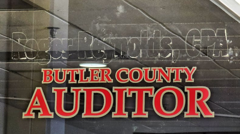 Roger Reynolds' name has been removed from the door of the Butler County Auditor's Office on High Street in Hamilton. NICK GRAHAM/STAFF