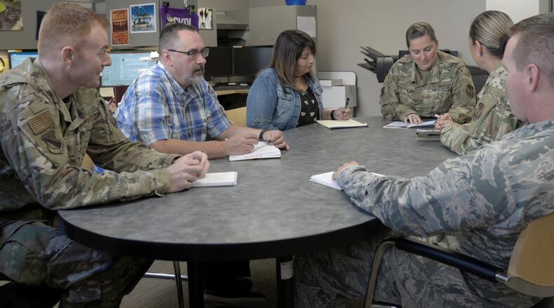 Members of the 88th Medical Group’s Patient Advocate and Group Practice Managers offices meet to discuss forecasting in order to ensure patients have access to care at Wright-Patterson Air Force Base, Oct. 1. (U.S. Air Force photo/Leticia Hopkins)