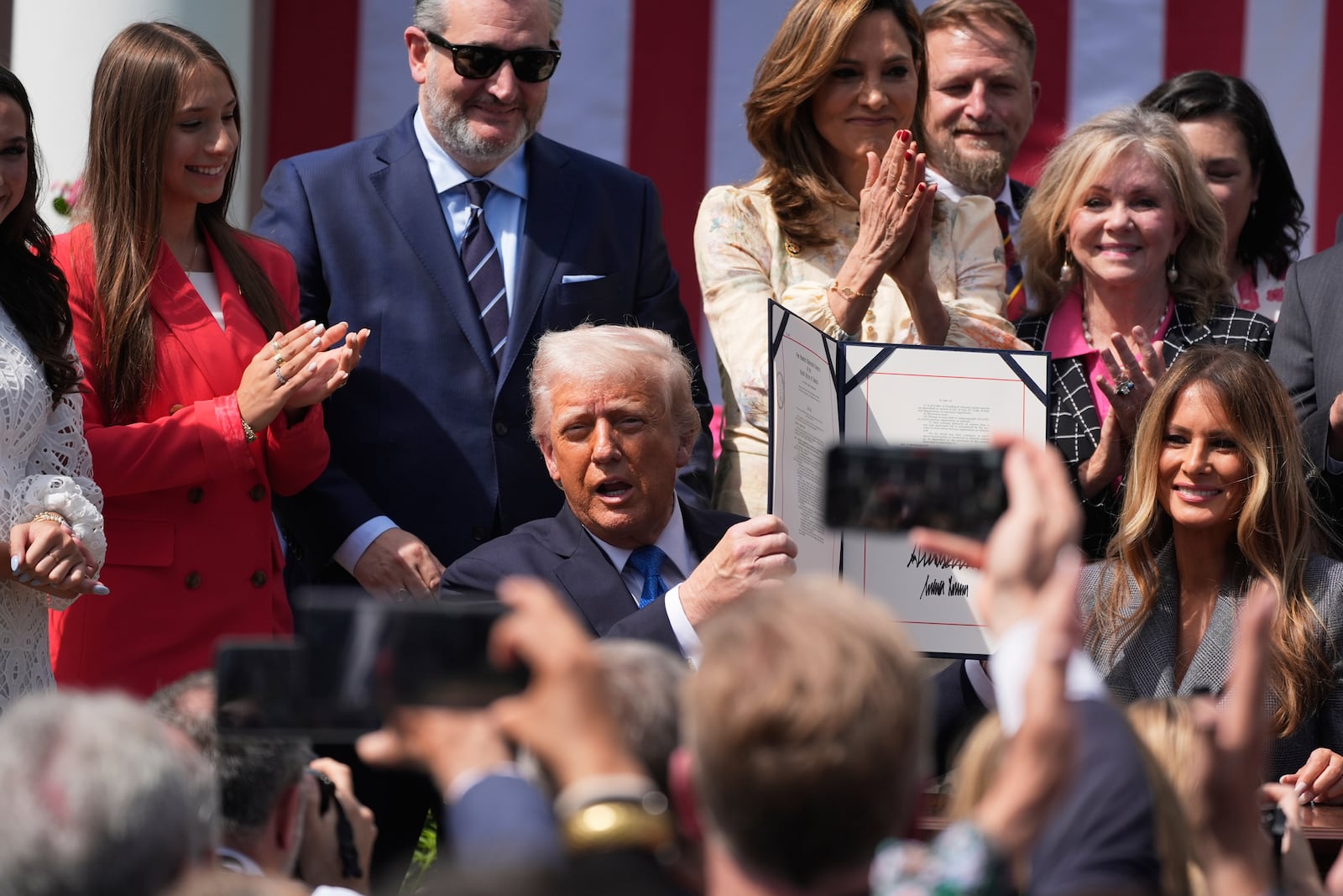 President Donald Trump, with first lady Melania Trump and others, after signing the "Take It Down Act" during a ceremony in the Rose Garden at the White House, Monday, May 19, 2025. (AP Photo/Manuel Balce Ceneta)