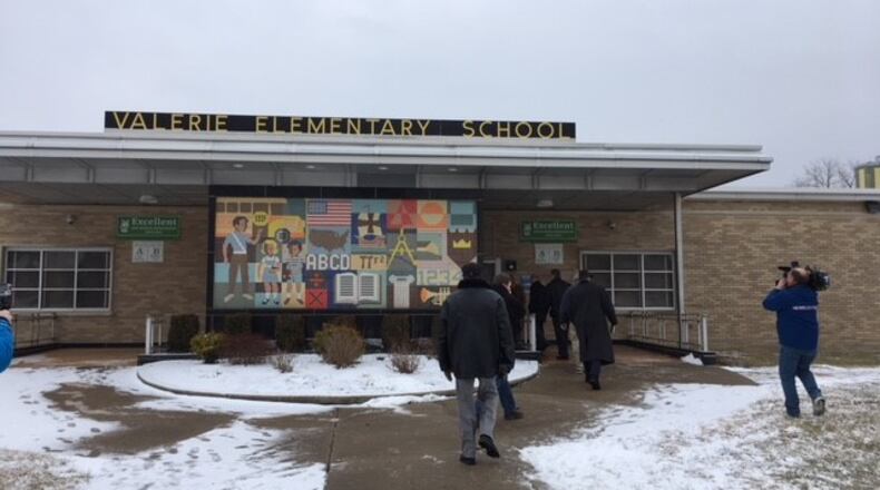 Members of a combined city-Dayton Public Schools task force studying school facilities tour Valerie Elementary School on Tuesday, Feb. 6. The tours ended before scheduled because of a legal challenge. SEAN CUDAHY/STAFF