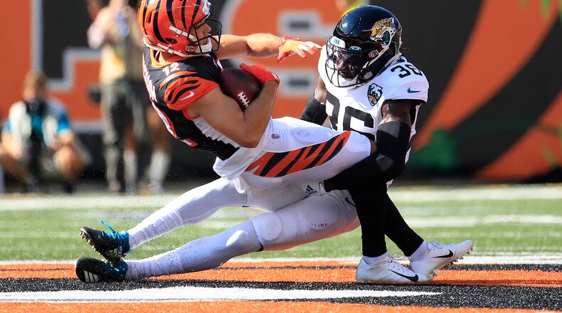 CINCINNATI, OHIO - OCTOBER 20: Alex Erickson #12 of the Cincinnati Bengals is tackled by Ronnie Harrison #36 of the Jacksonville Jaguars at Paul Brown Stadium on October 20, 2019 in Cincinnati, Ohio. (Photo by Andy Lyons/Getty Images)