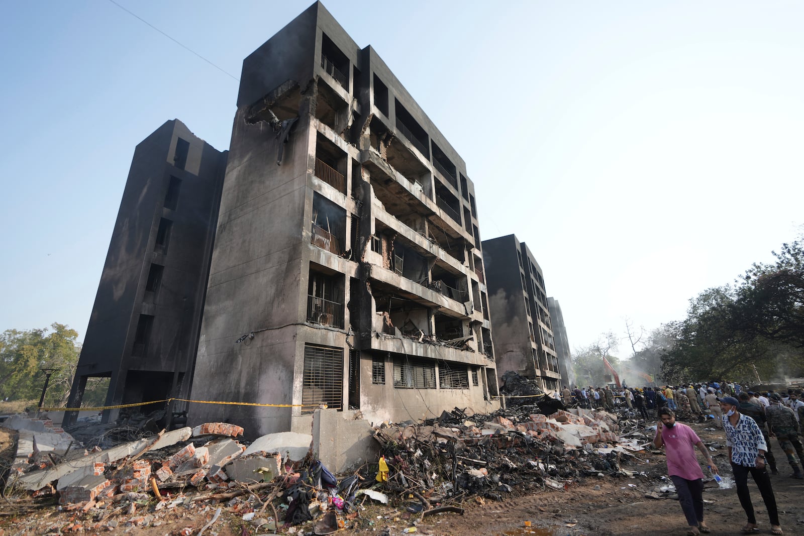 Search and rescue teams respond to the scene of a plane crash in Ahmedabad, India, Thursday, June 12, 2025. (AP Photo/Ajit Solanki)
