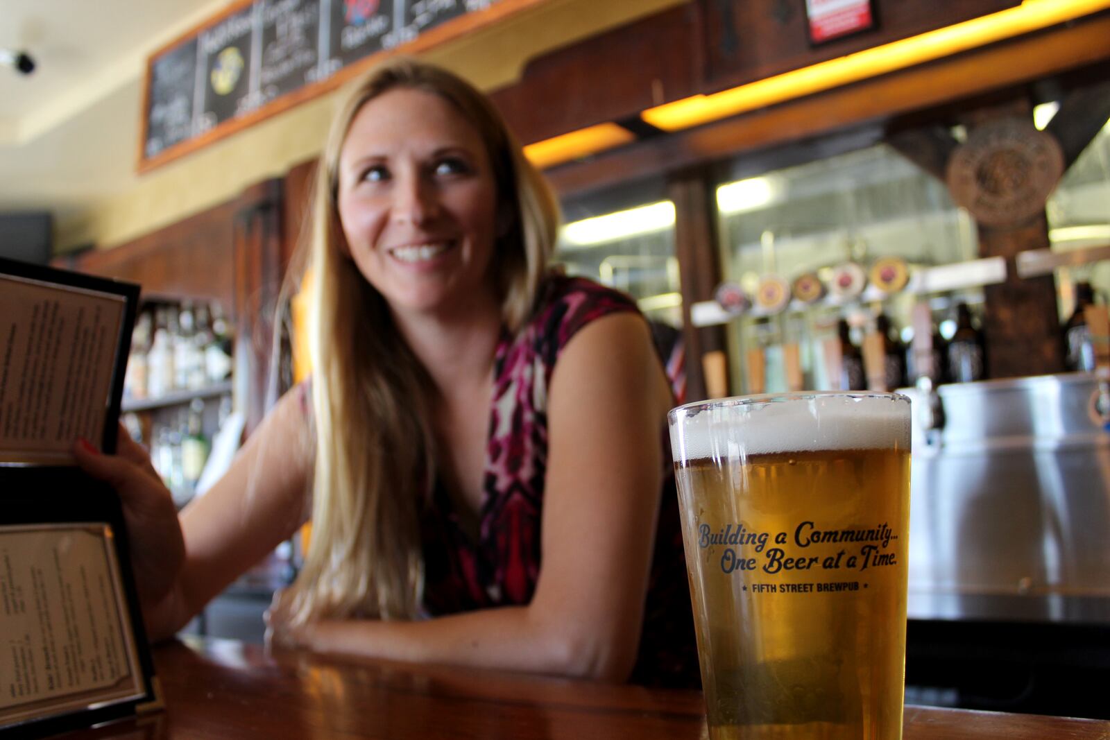 Fifth Street Brewpub has raised $50,000 for local charities since it launched its giveback Monday program in 2013.  Tanya Brock is the pub's general manager.