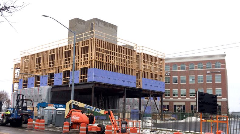 Construction continues on the new 115-room Fairfield Inn and Suites in downtown Dayton. The hotel is being raised at the northeast corner of Patterson Boulevard and Monument Avenue. Construction is expected to finish later this year. LISA POWELL / STAFF