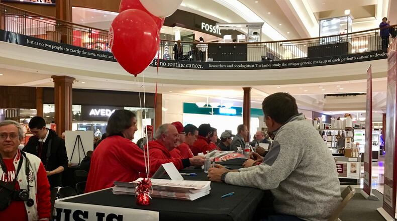 Jim Day signs autographs on the first day of the Reds Winter Caravan 2018.