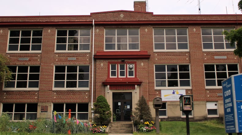 The Bellbrook School District is looking to divest itself of the old Sugarcreek Elementary School, established 100 years ago this year. CONTRIBUTED