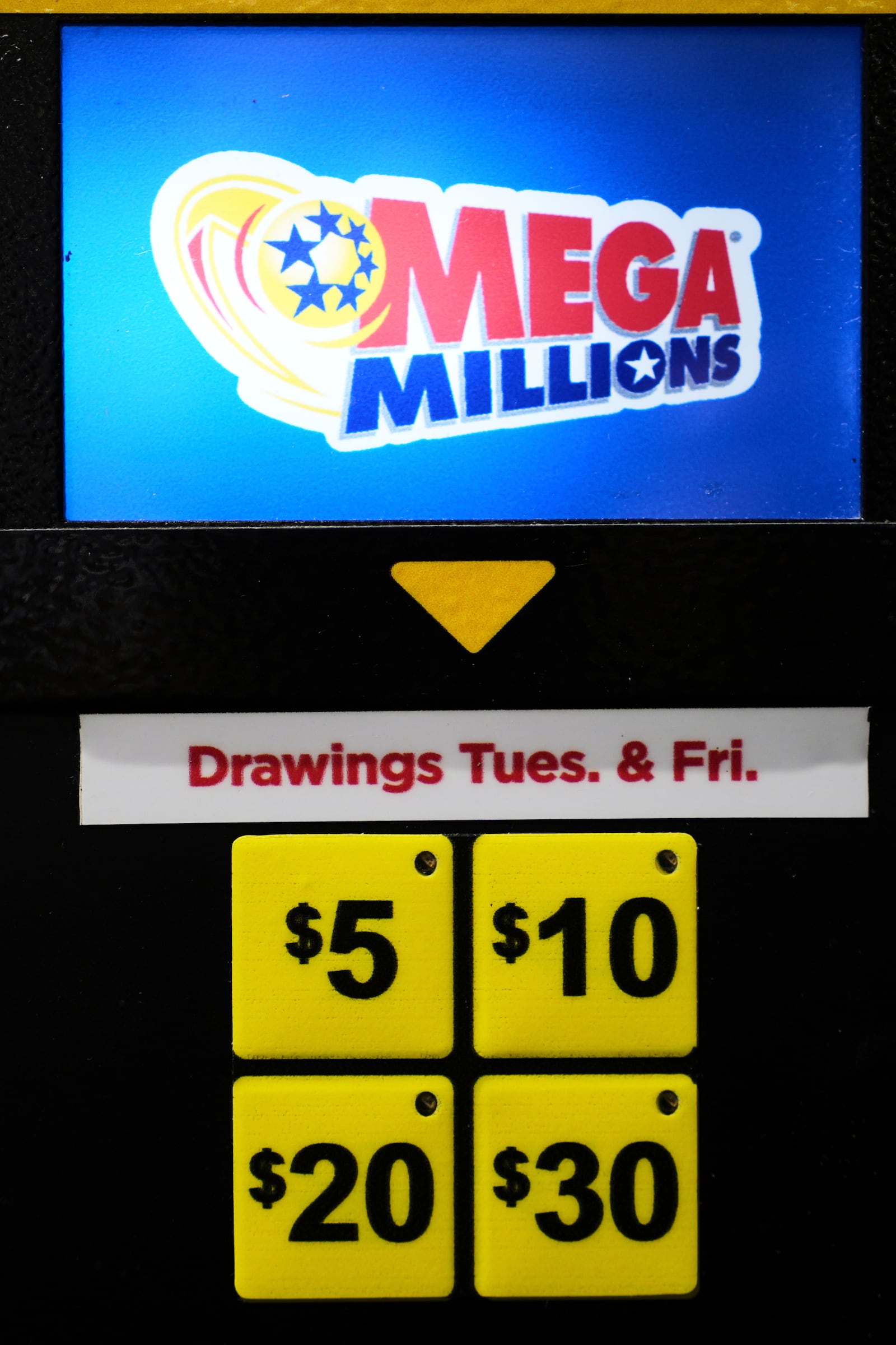A Mega Millions lottery ticket vending machine is seen at a convenience store in Chicago, Sunday, April 6, 2025. (AP Photo/Nam Y. Huh)