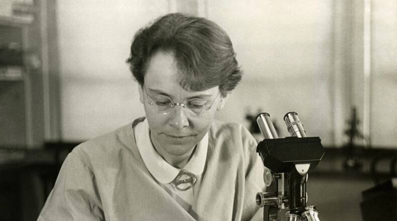Barbara McClintock (1902-1992), Department of Genetics, Carnegie Institution at Cold Spring Harbor, New York, shown in her laboratory. This photograph was distributed when McClintock received the American Association of University Women Achievement Award in 1947 for her work on cytogenetics. (From Smithsonian Institution Archives)