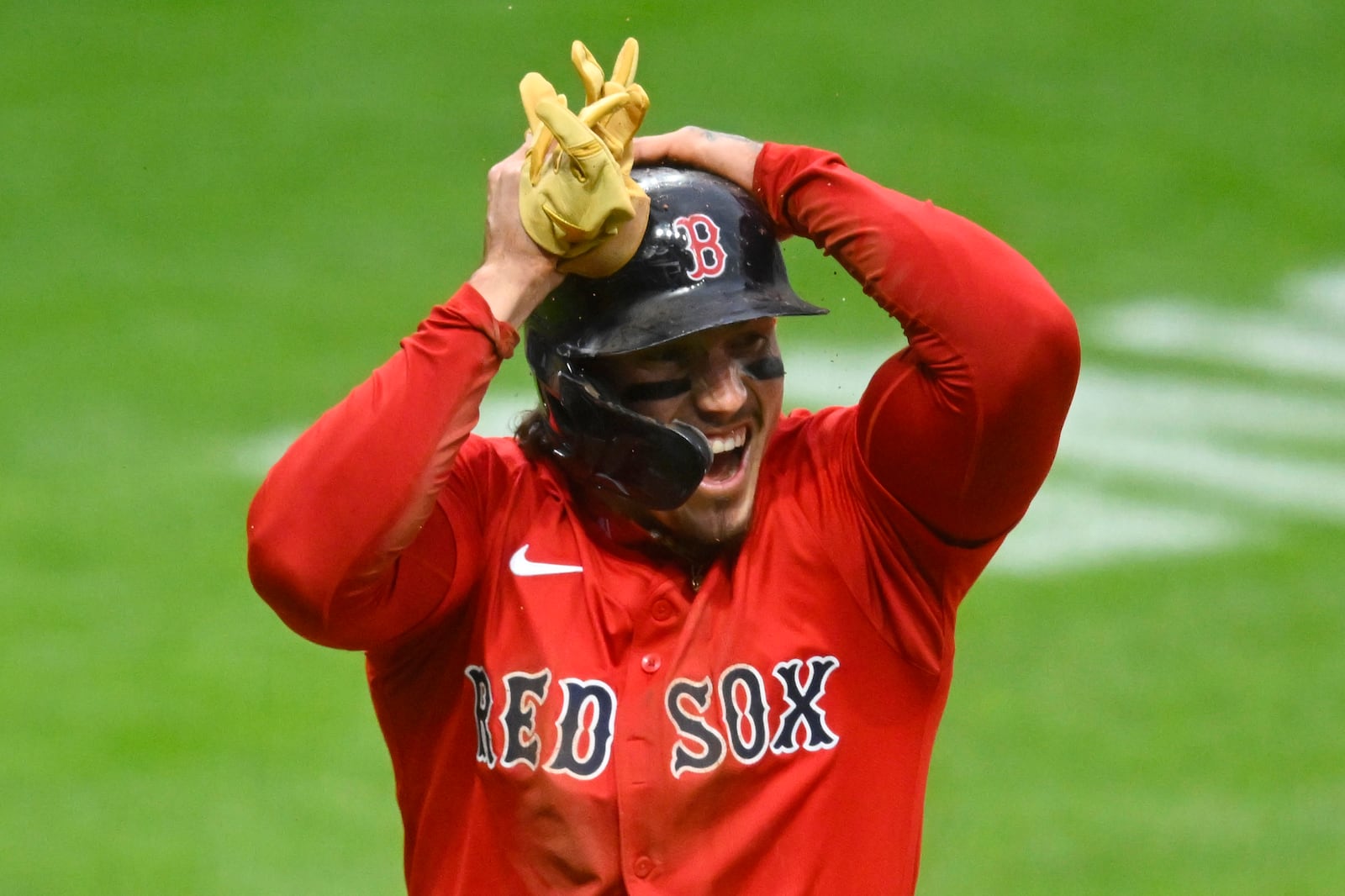 Boston Red Sox's Jarren Duran reacts after stealing home against the Cleveland Guardians during the third inning of the second baseball game of a doubleheader, Saturday, April 26, 2025, in Cleveland, (AP Photo/David Richard)