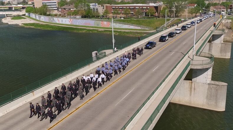 The 12th Annual Montgomery County Law Enforcement Officer Memorial Ceremony took place at RiverScape in Dayton earlier this year after a parade of law enforcement members, a Scottish bagpipe and drum band and 20 vehicles came across the Riverside Drive Bridge. TY GREENLEES / STAFF