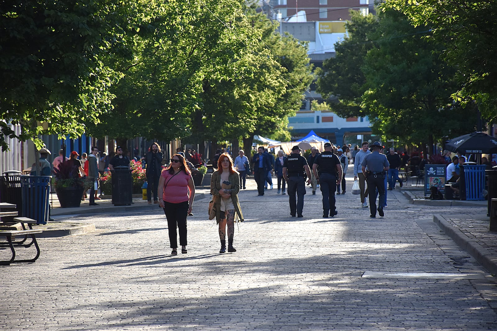 A large number of law enforcement were patrolling in the Oregon District ahead of delegates from the NATO assembly visiting the historic section of Dayton on Saturday, May 24, 2025. CORNELIUS FROLIK / STAFF
