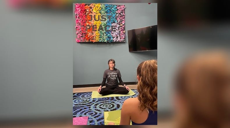 Kali Macklin of the Traditional Yoga Society leads a weekly yoga practice at the International Peace Museum.
