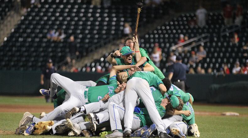 Chaminade Julienne celebrates a victory against Wapakoneta in the Division II state championship on Saturday, June 2, 2018, at Huntington Park in Columbus. David Jablonski/Staff
