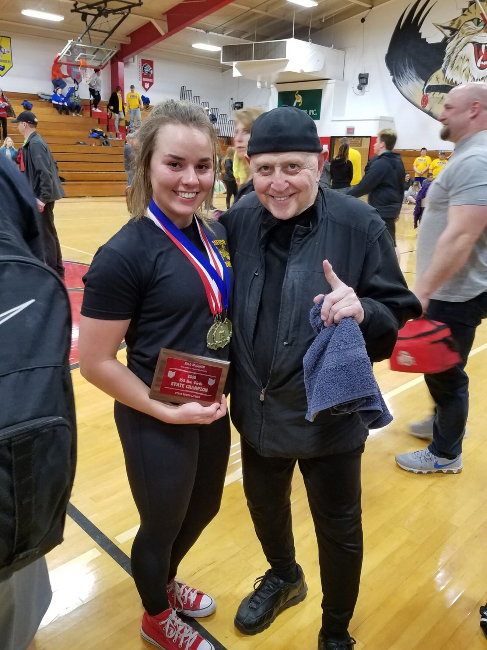 Kelsi Hoops is pictured after winning her second straight state high school title in Kenton this past March. She’s with her trainer/mentor Larry Pacifico, the famed world champion powerlifter. CONTRIBUTED