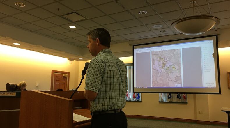 Warren County Sanitation Engineer Chris Brausch fields questions during Tuesday’s Board of Warren County Commissioners meeting.STAFF/LAWRENCE BUDD