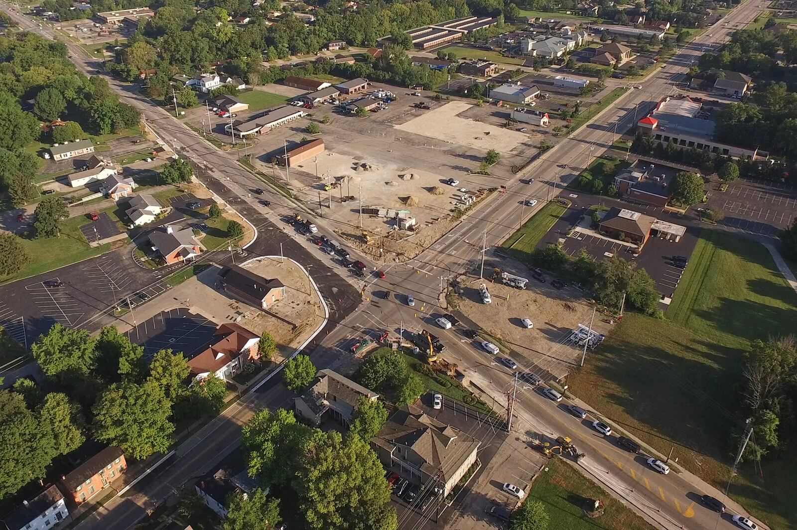 Downtown Springboro is transforming as an old shopping center is razed and a major intersection is widened.   TY GREENLEES / STAFF