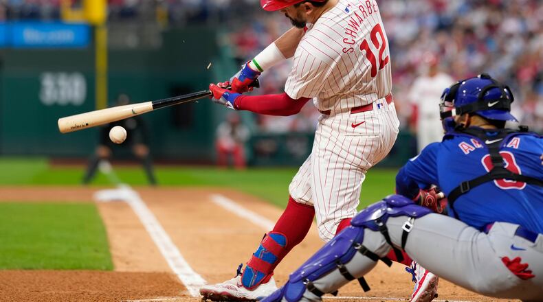 Philadelphia Phillies' Kyle Schwarber breaks his bat on a ground out against Chicago Cubs pitcher Javier Assad during the first inning of a baseball game, Wednesday, Sept. 25, 2024, in Philadelphia. (AP Photo/Matt Slocum)