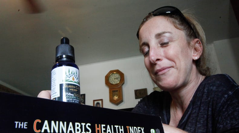 Lorrie Callahan of West Milton, who has multiple sclerosis, uses cannabidiol to control pain and is now an advocate for medical marijuana patients in Ohio. CHRIS STEWART / STAFF