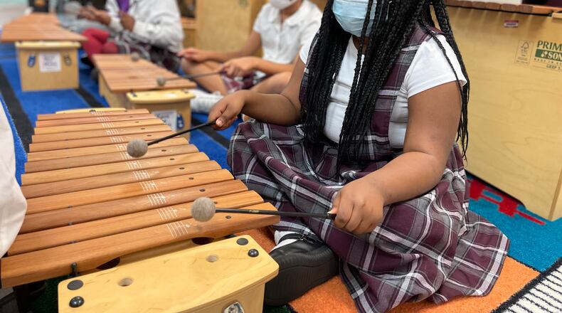 Students in a third-grade class at Charity Adams Earley Girls Academy played xylophones and sang along to “Old Black Fly." File photo.