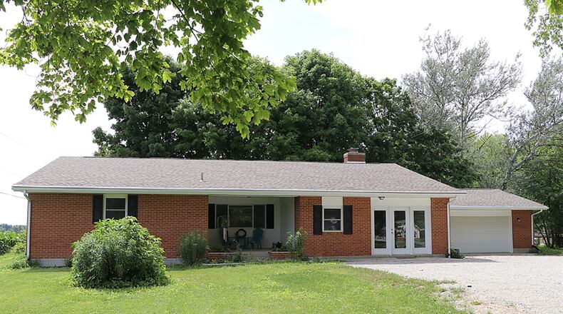 The vinyl-sided, 3-bedroom ranch has about 2,060 sq. ft. of living space and an oversized, 2-car garage. The house sits well off the road at the end of a gravel driveway. CONTRIBUTED PHOTO BY KATHY TYLER