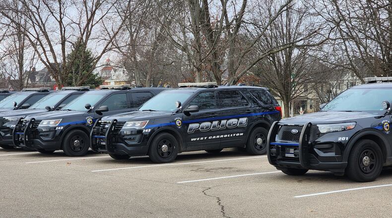 West Carrollton police cruiser sit outside the police department Tuesday, Dec. 13, 2022. The city's police officers and sergeants will receive raises for in 2013, 2014 and 2015. ERIC SCHWARTZBERG/STAFF