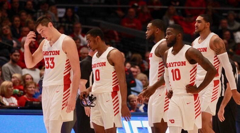 Dayton players return to a huddle during a game against Indiana State on Saturday, Nov. 16, 2019, at UD Arena. David Jablonski/Staff